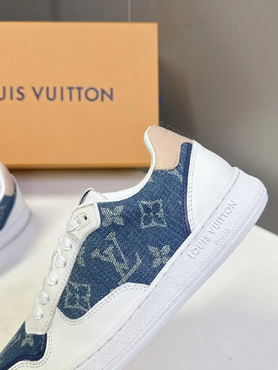 View 3 of Denim-Accent Luxury Sneakers with LV Flair
