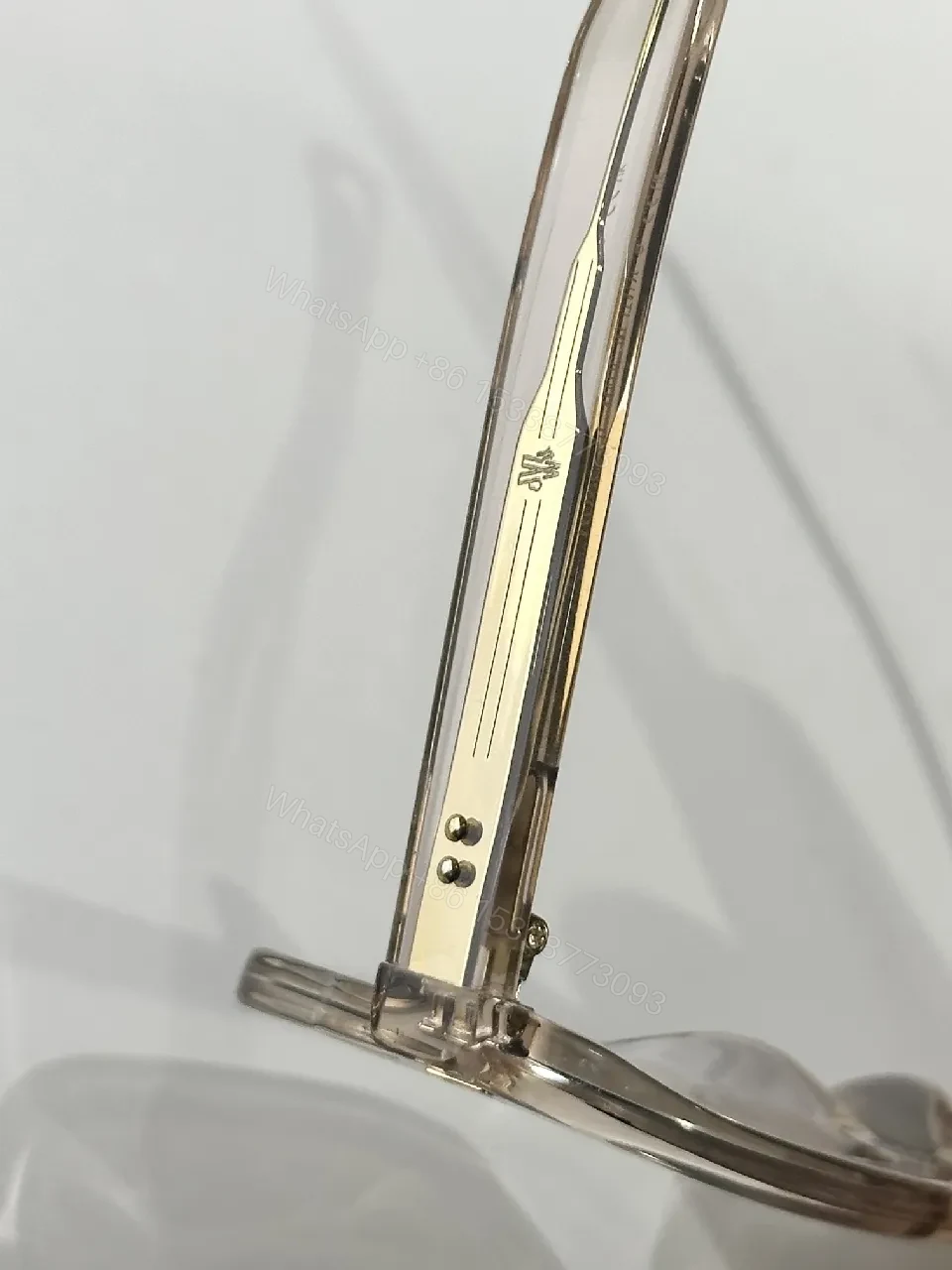 View 6 of Translucent Frame Sunglasses with Amber Lenses and Gold Accents