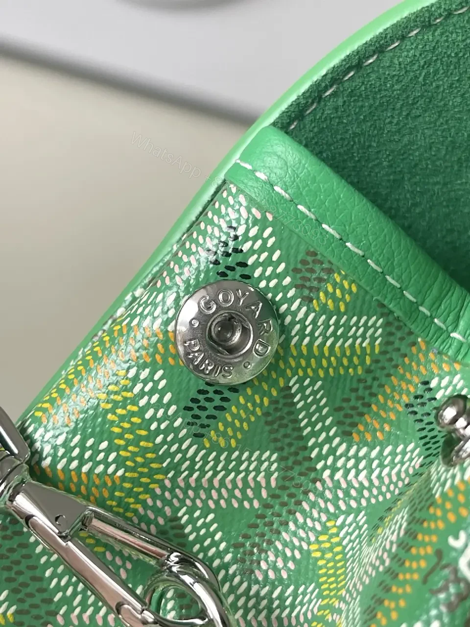 View 4 of green leather mini backpack with monogram pattern and luxury green trim for everyday use
