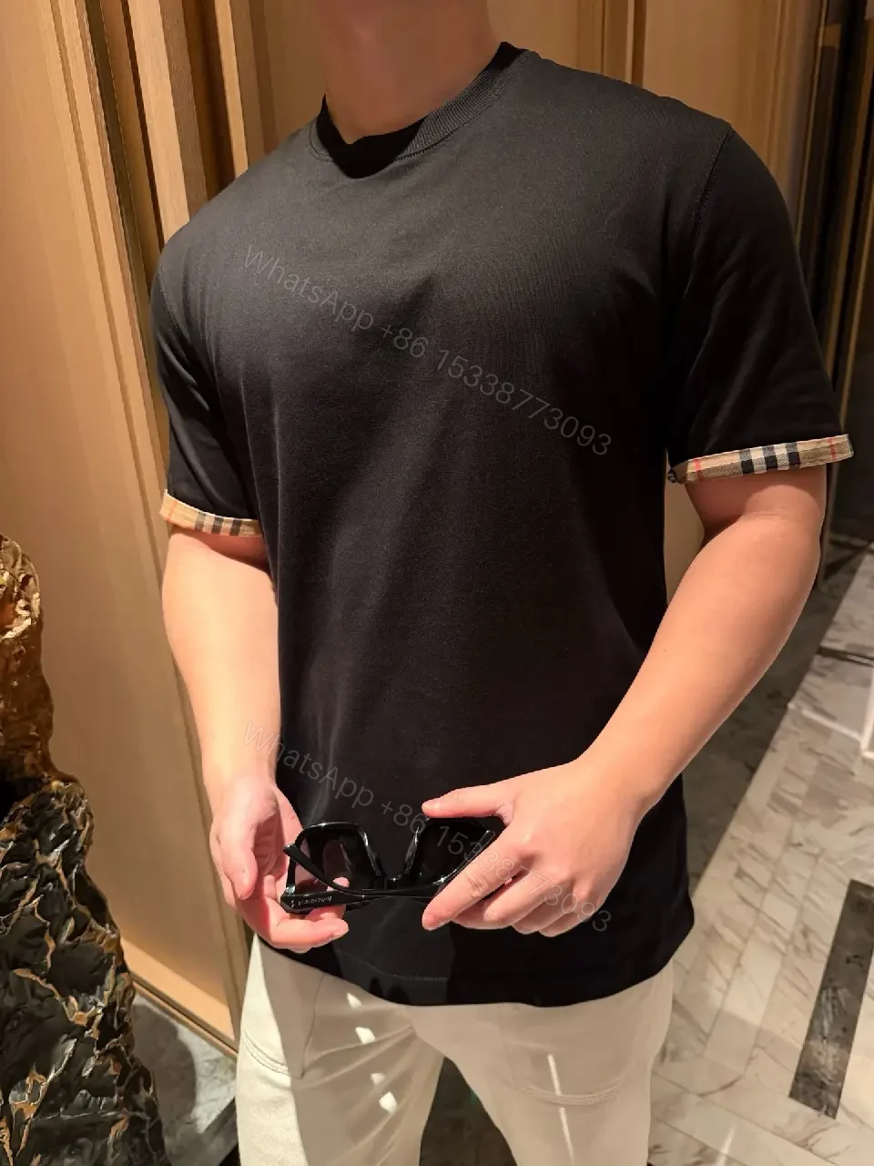 View 5 of Minimalist Black Cotton Tee with Plaid Sleeve Trim