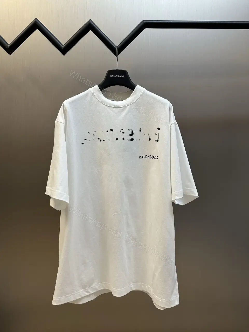 View 8 of Oversized Graphic Tee with Subtle Distress and Logo – Premium Cotton