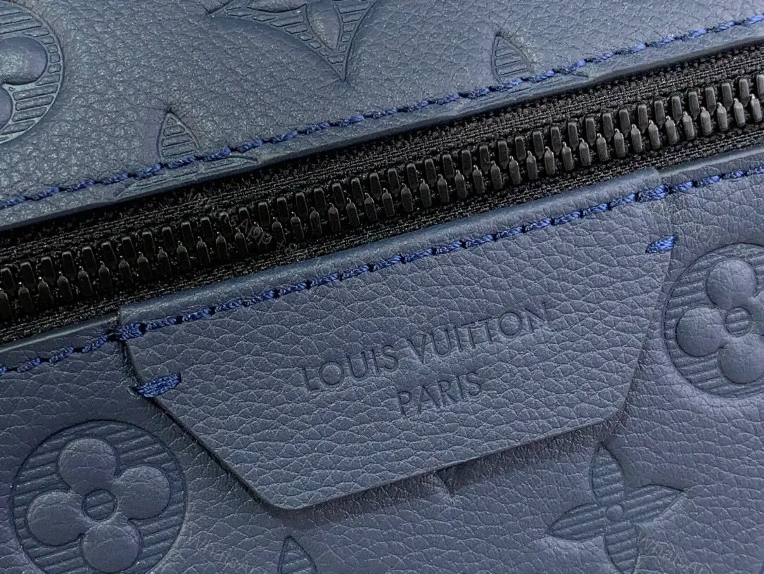View 2 of Compact Monogram Backpack: Textured Luxury, Everyday-Ready