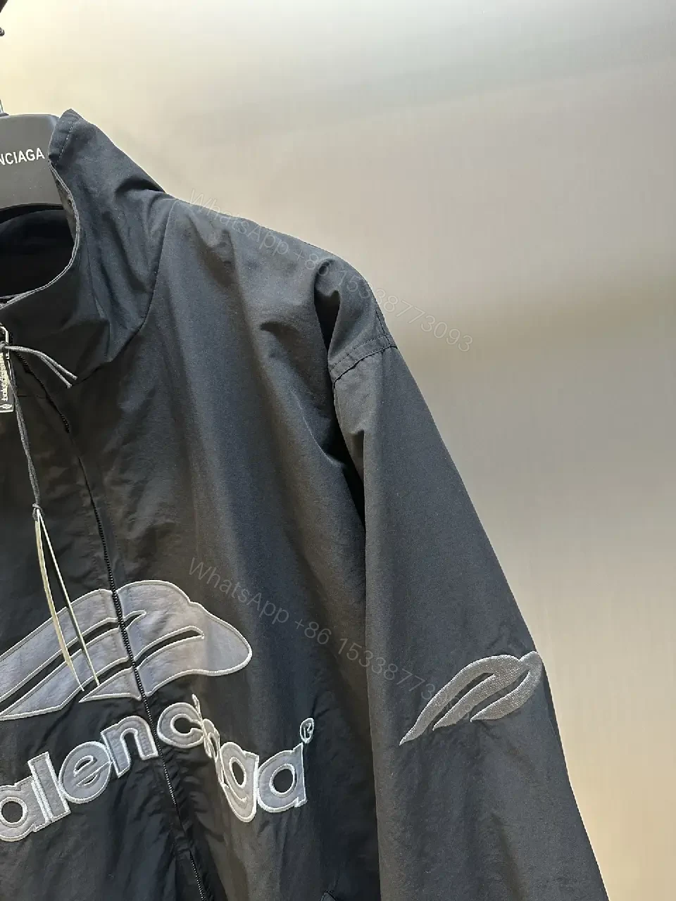 View 7 of Black Nylon Windbreaker Modern Logo-Driven Streetwear Jacket