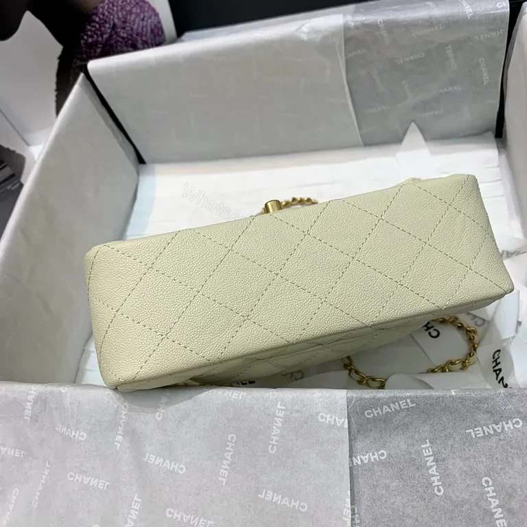 View 7 of Compact Quilted Handbag with Gold Chain Strap - Timeless Luxury