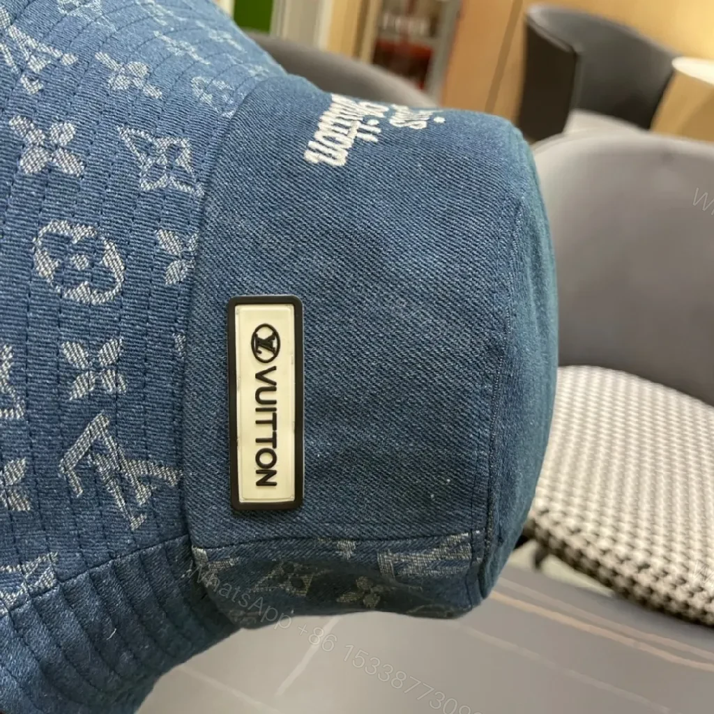 View 3 of Denim Bucket Hat with Monogram Detail – Sun Protection