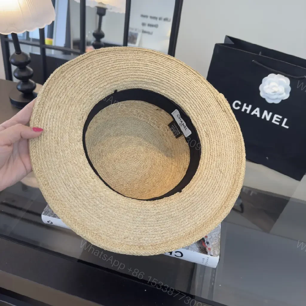 View 2 of Natural Straw Fedora Hat with Bow Ribbon Detail - Chanel Logo
