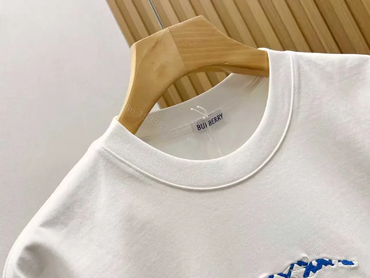 View 2 of Black Knit Tee with Embroidered Crest Logo – Premium Street Style T-shirt