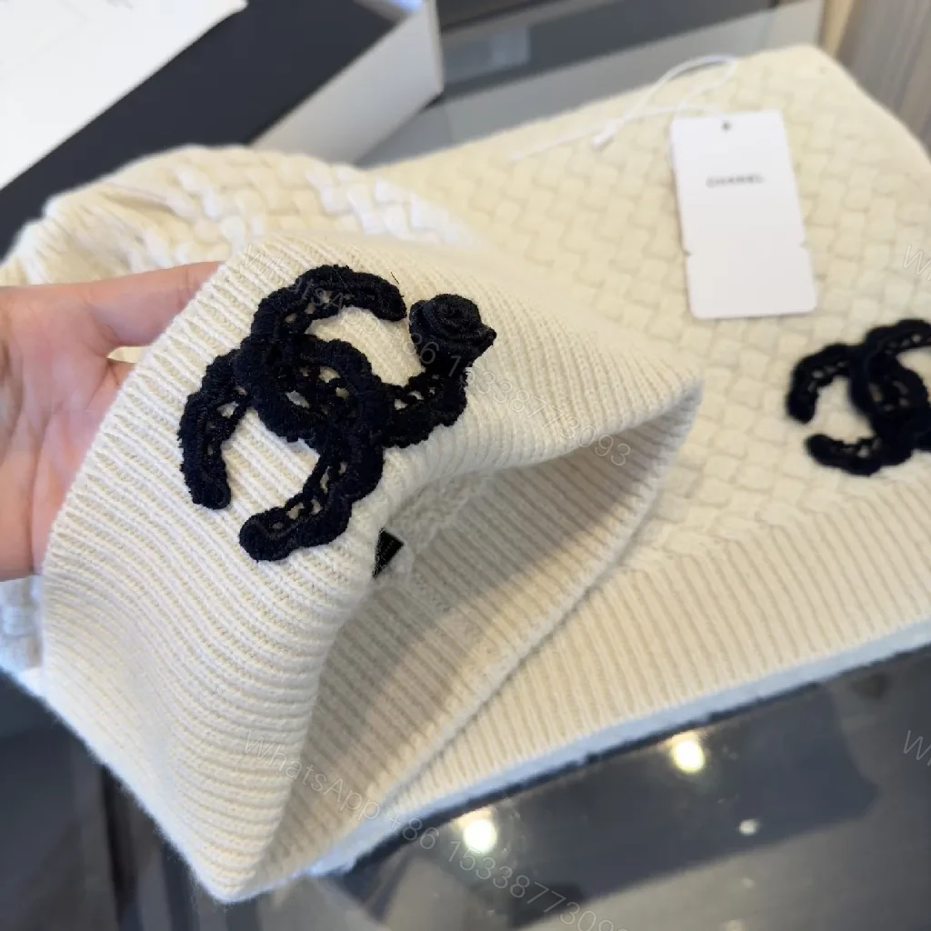View 5 of Ivory Knit Set: Textured Luxury with Iconic Emblem