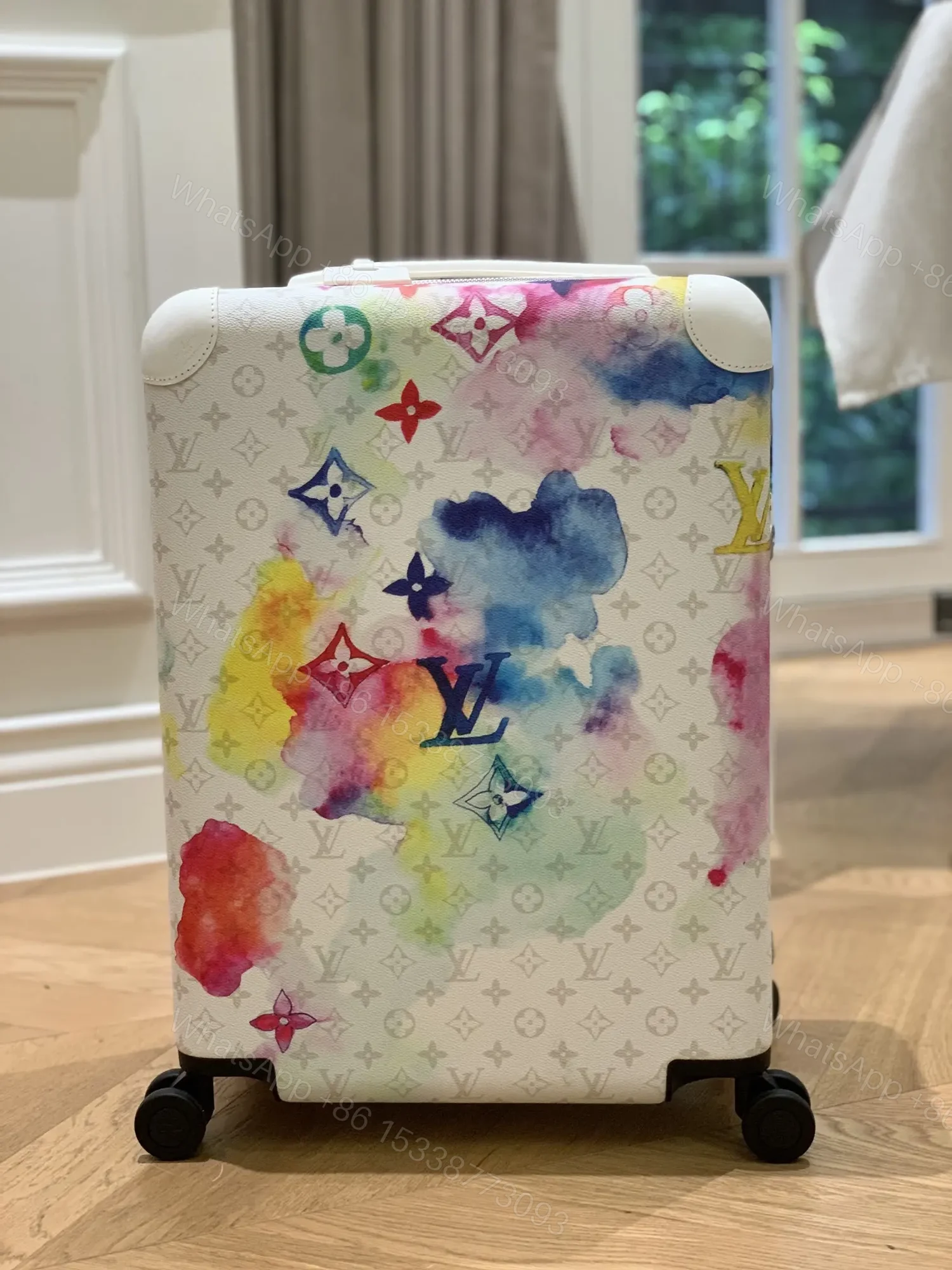 View 2 of Louis Vuitton Horizon 55 suitcase in the Watercolor Multicolor
