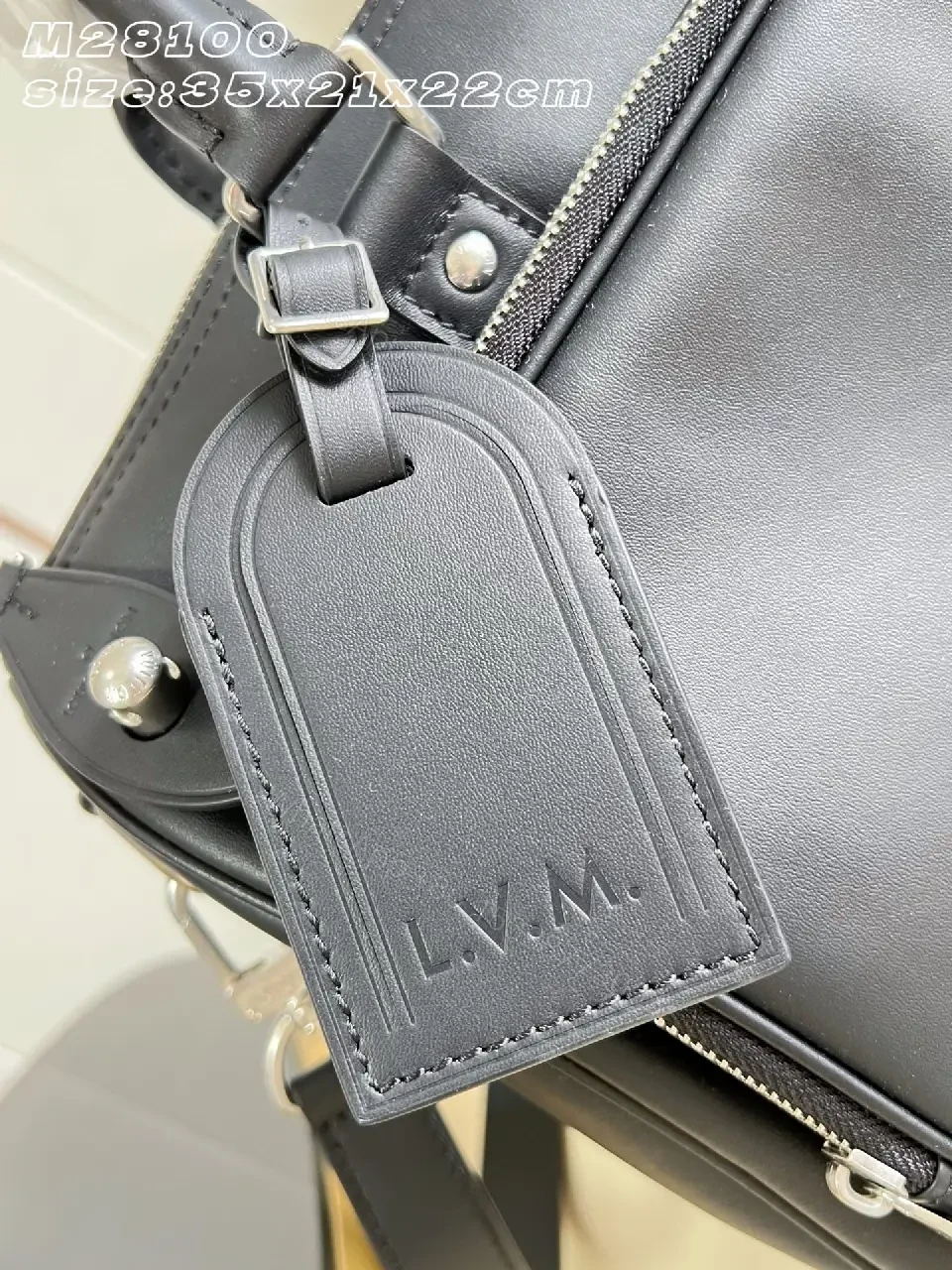 View 4 of Black leather structured satchel with top handle, removable strap, smooth finish, Louis Vuitton Paris (no brand details)