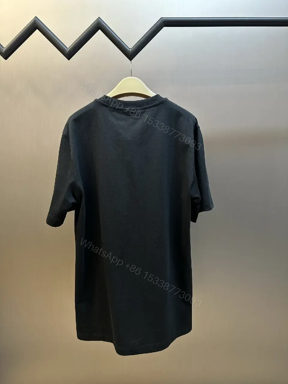 View 4 of Oversized Black Tee with Crest – Premium Cotton, Luxe Casual Tee