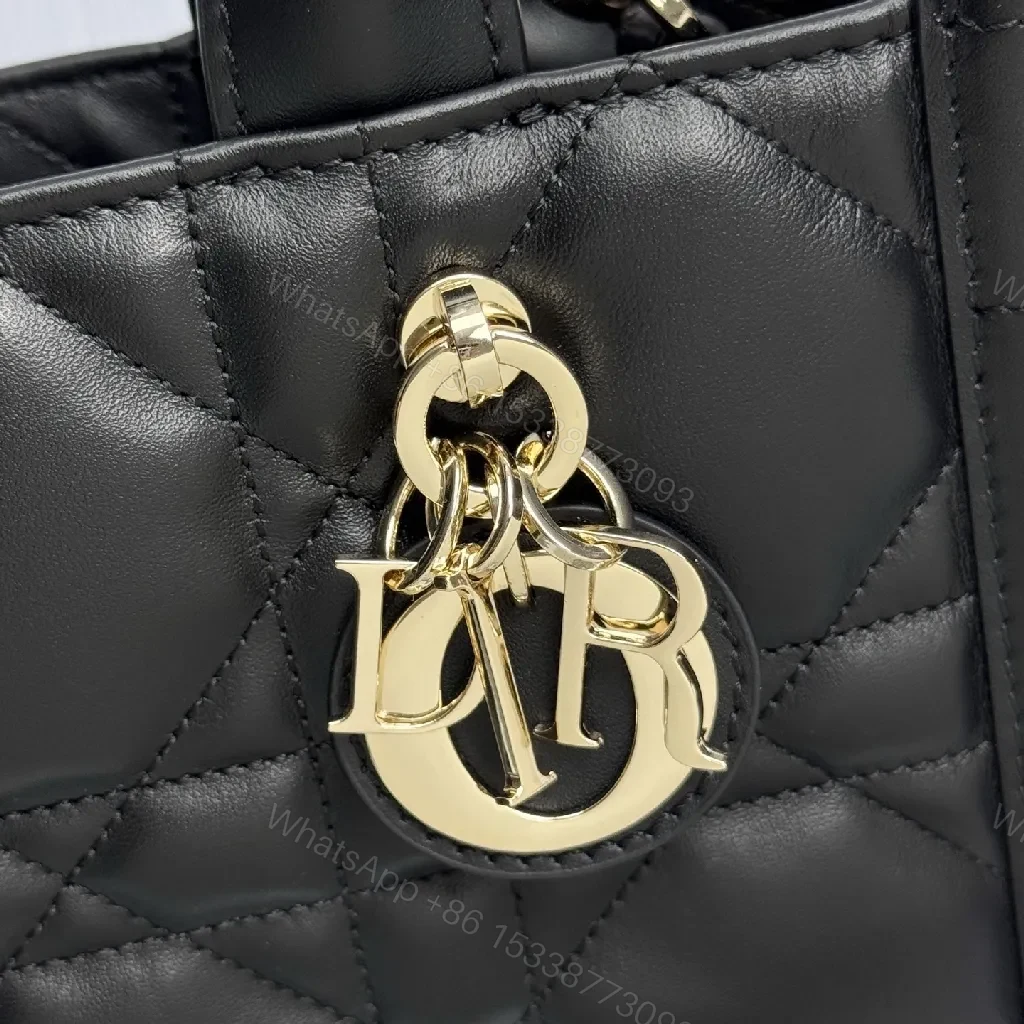View 8 of Quilted Mini Bag: Diamond Stitch, Gold Charm, Crossbody Carry