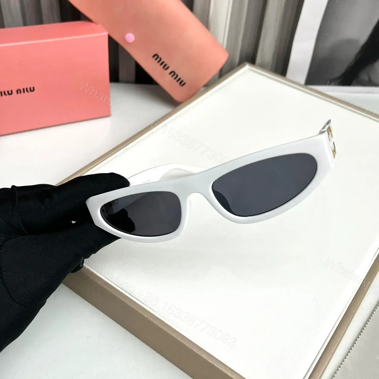 View 2 of Miu Miu Cat Eye White Sunglasses Women