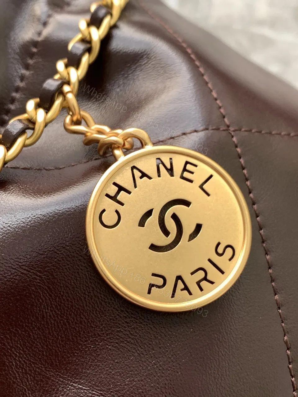 View 8 of Gold-Traced Quilted Bucket Bag: Luxury Leather, Iconic Hardware