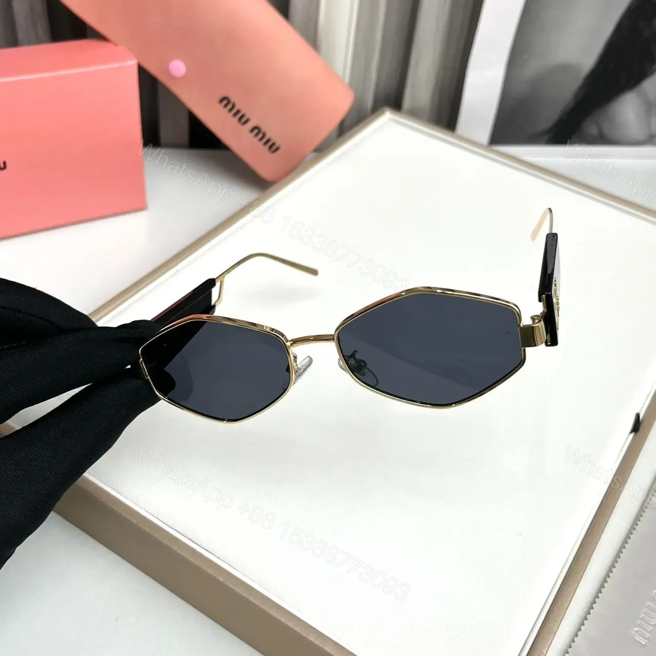 View 2 of Miu Miu Hexagon Black-Gold Sunglasses Universal