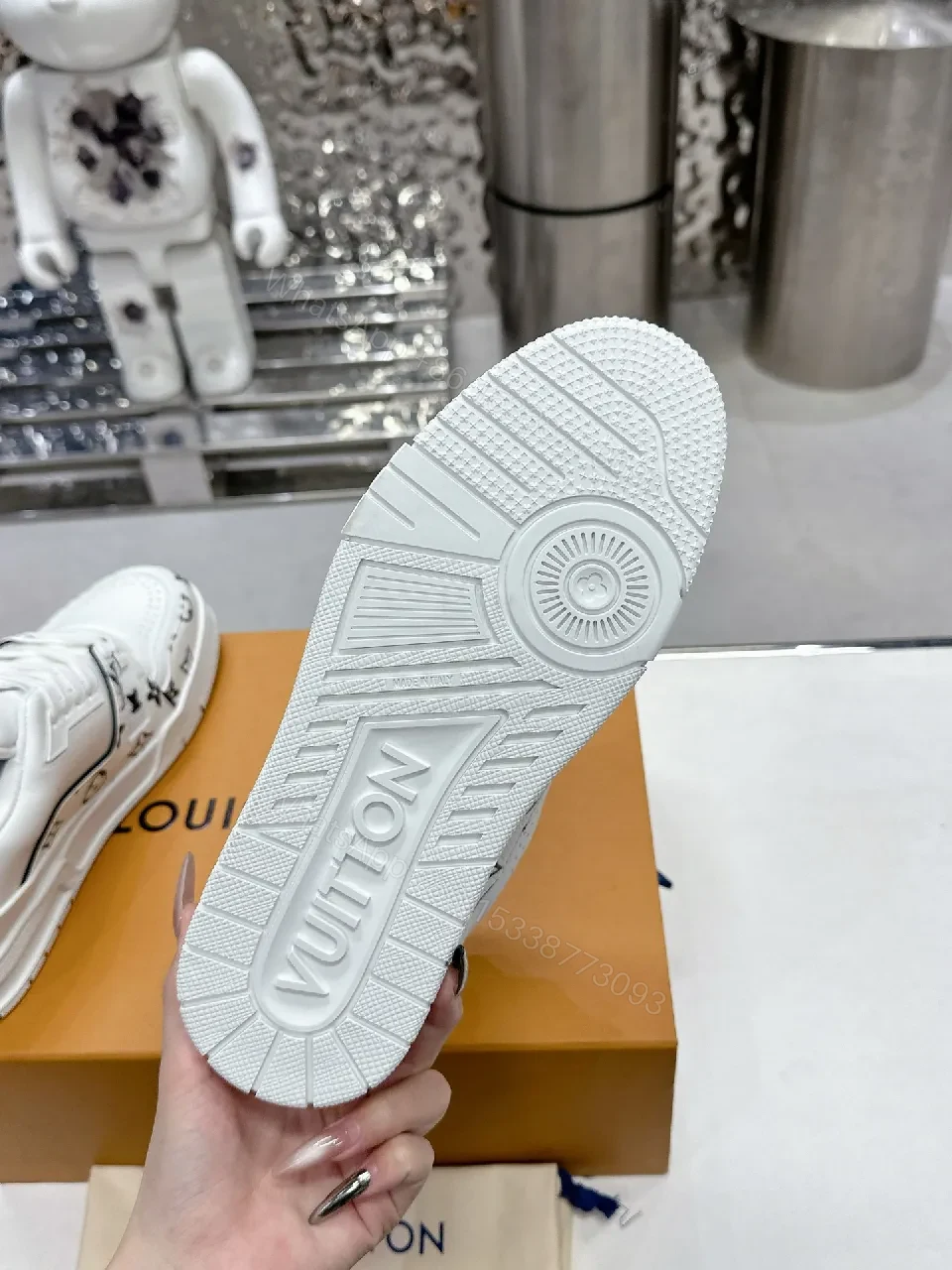 View 9 of White Leather Sneaker, Monogram Motif, Luxe Street Style, Designer Flair, Sneaker