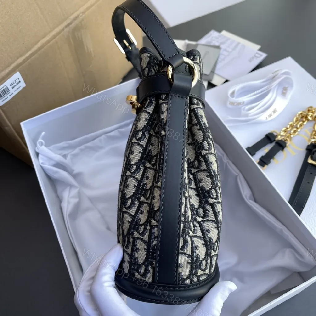 View 5 of Structured Classic Monogram Canvas Bucket Bag with Gold Hardware
