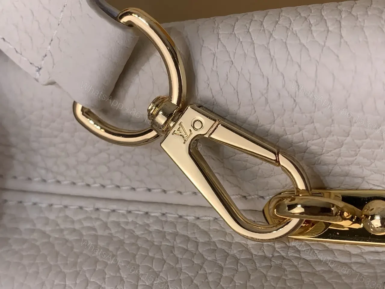 View 9 of Chic Textured Leather Mini Bag with Gold Emblem