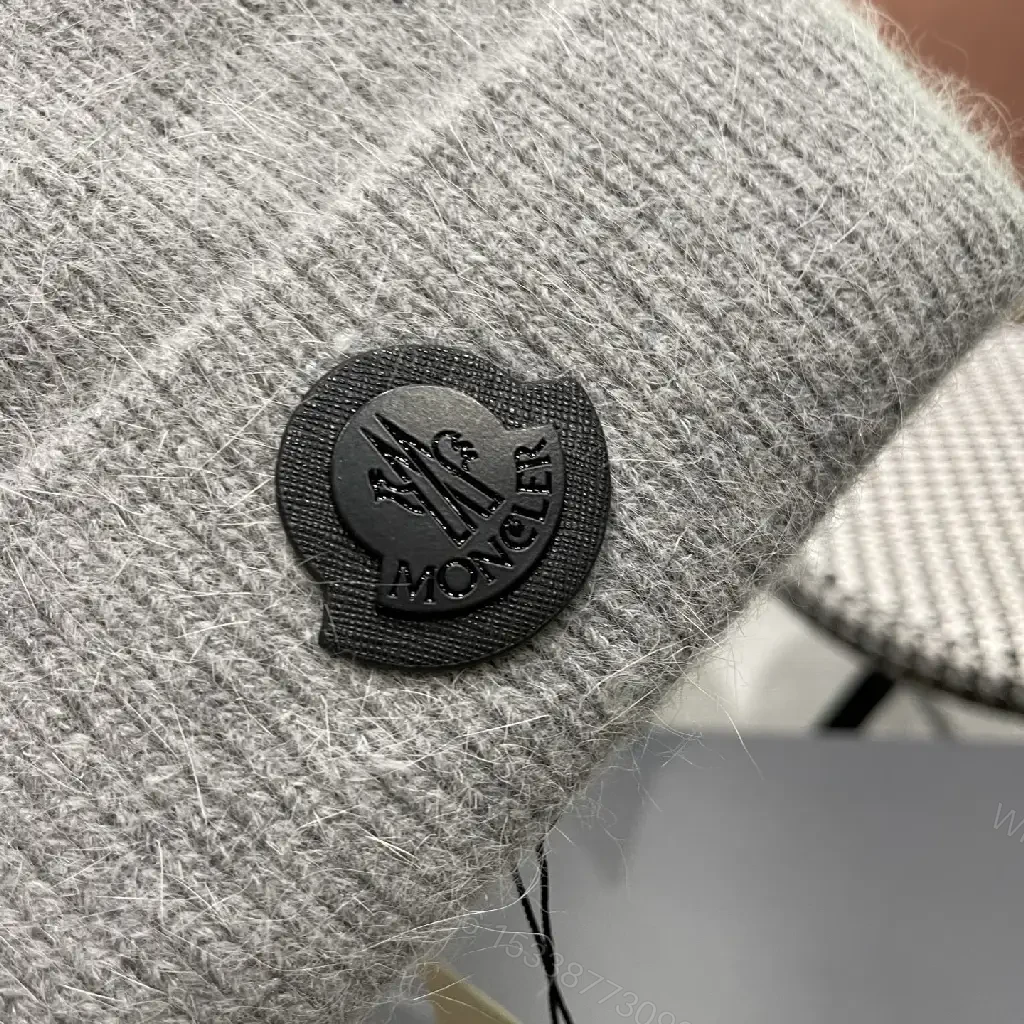 View 3 of Cozy Perimeter Beanie: Textured Knit, Subtle Emblem, Neutral Gray