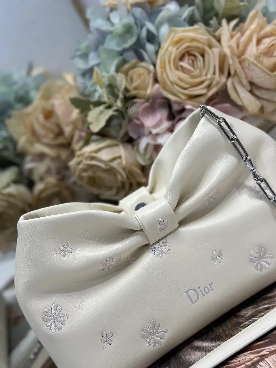 View 2 of Chic Nappa Leather Mini Handbag with Bow Embroidery