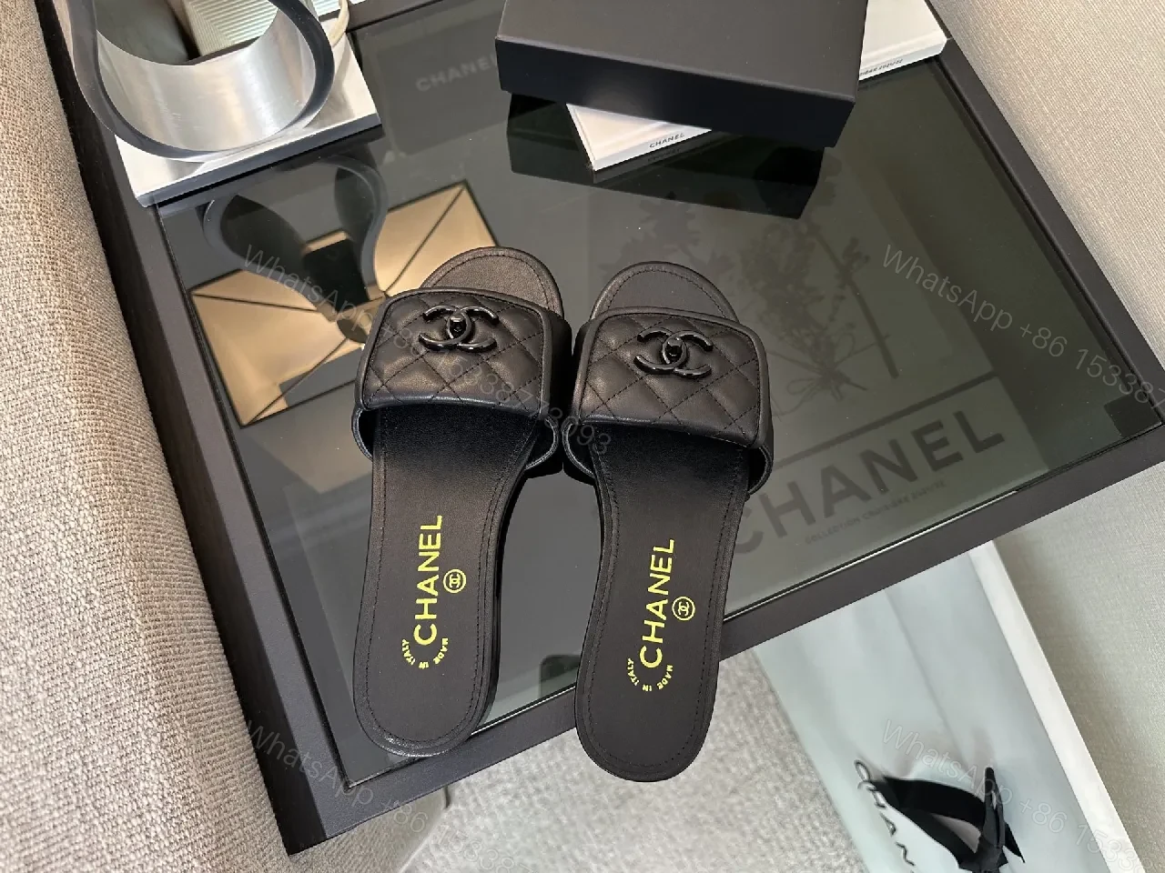 View 9 of Chic Black Quilted Slides with Logo Detailing