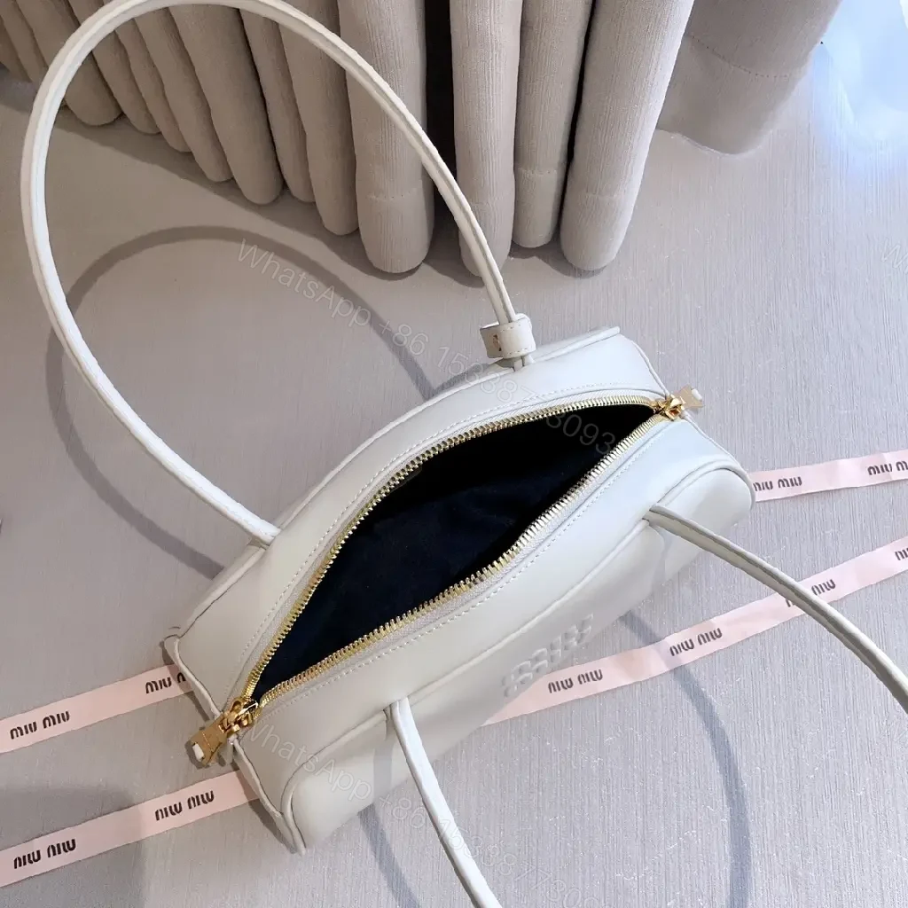 View 9 of Light Leather Dome Bag in Soft Hue, Compact Day-to-Night Carry