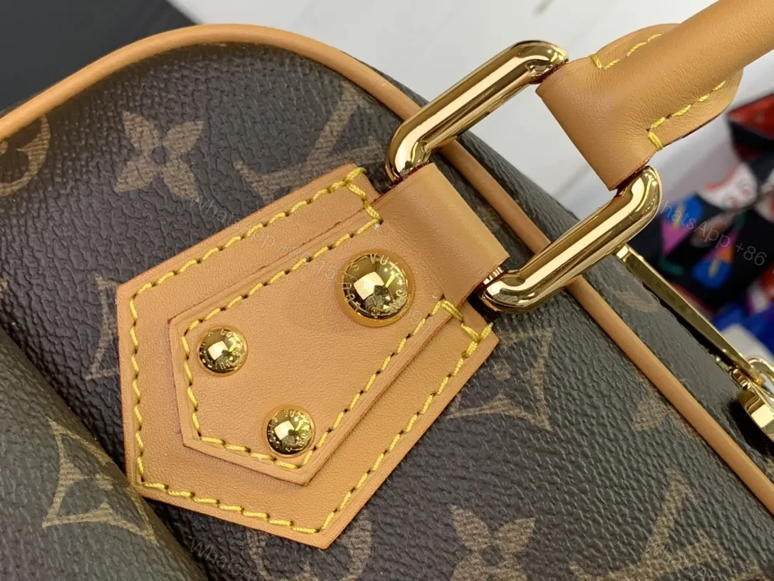 View 5 of Structured Luxury Monogram Handbag with Gold Hardware and Leather Trim