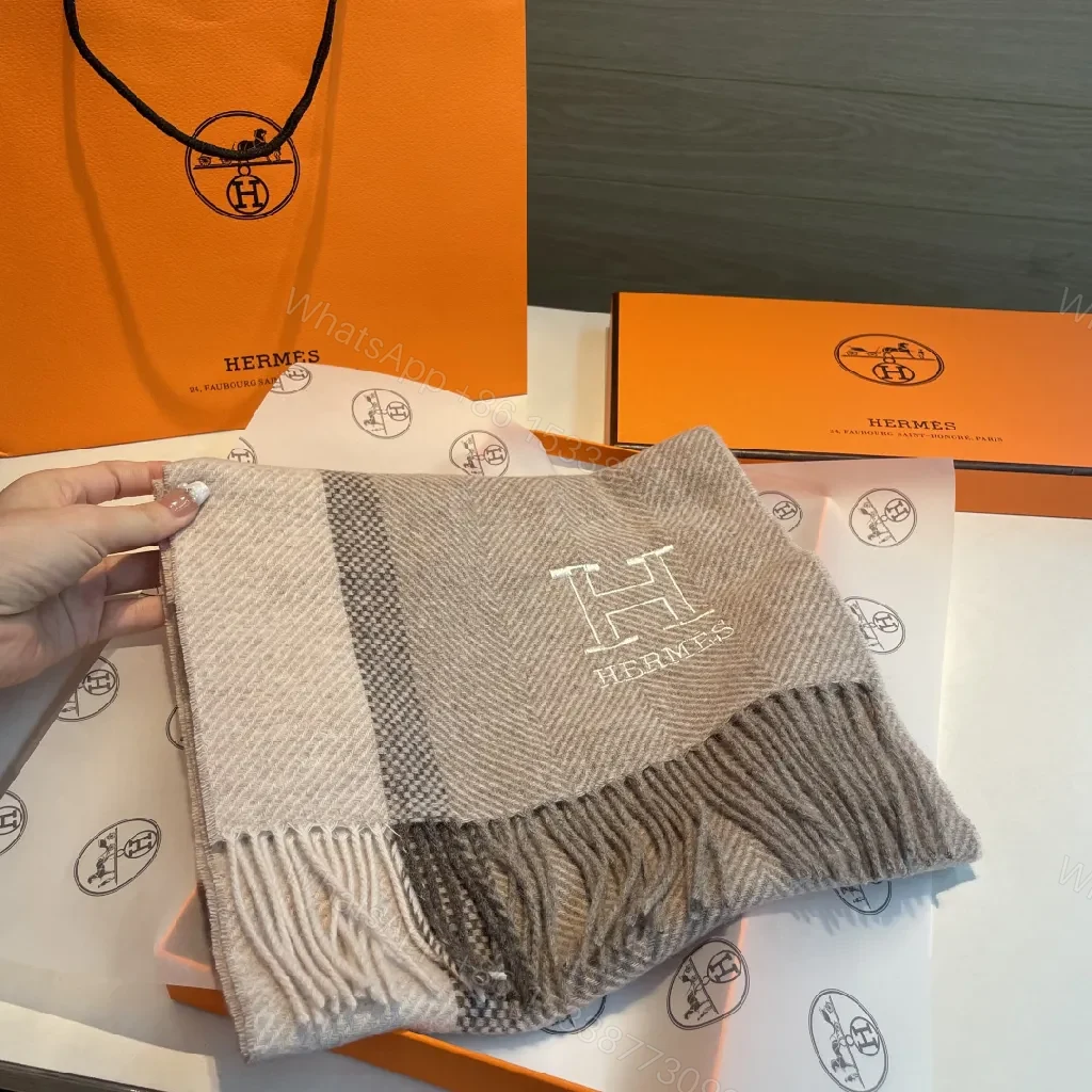 View 9 of Neutral Herringbone Knit Scarf with Subtle Emblem Detail