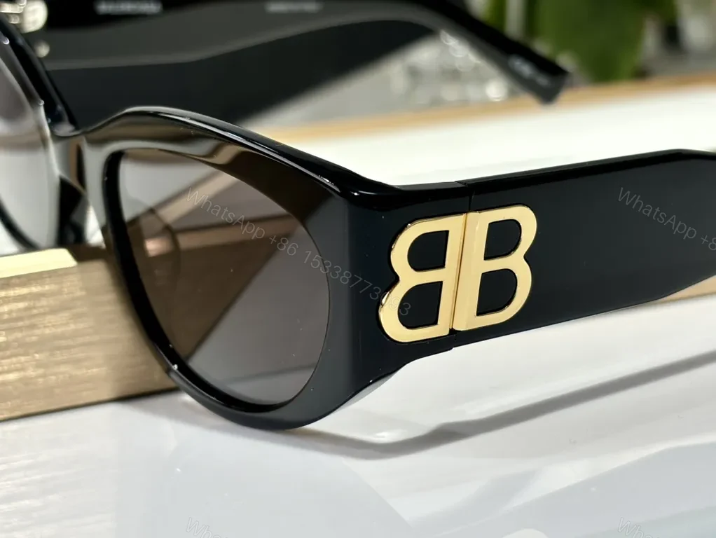 View 7 of Bold Black Frames with Gold BB Emblem Sunglasses