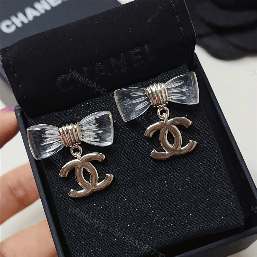 View 2 of CHANEL D25 CC BOW EARRINGS GOLD METAL ABF537 B19997 NAFVG