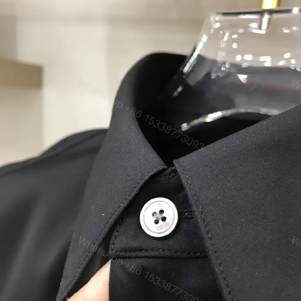 View 8 of Minimal Black Shirt Jacket with Subtle Logo Button Front