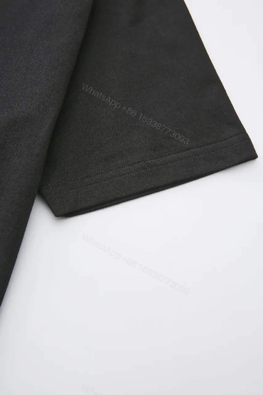 View 7 of Minimalist Black Cotton Tee with Subtle Embossed Logo - T‐Shirt
