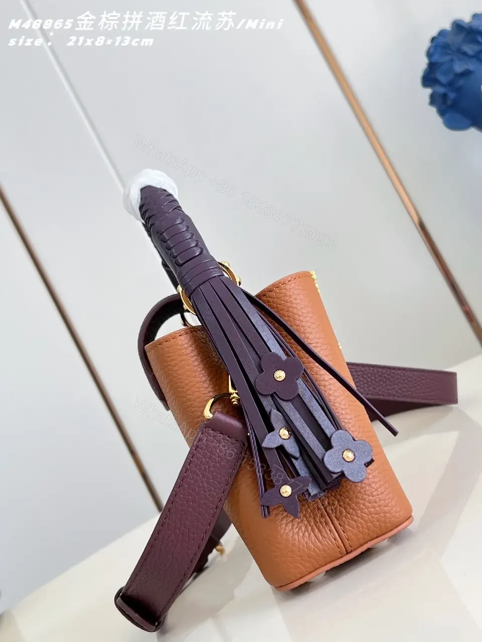 View 5 of Caramel Leather Mini Bag: Structured, Gold Emblem, Compact Luxury