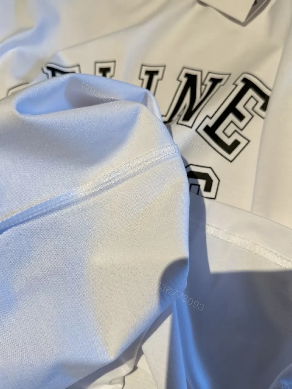 View 2 of White Cotton Modern Tee: Bold Logo, Premium Comfort, Everyday Style
