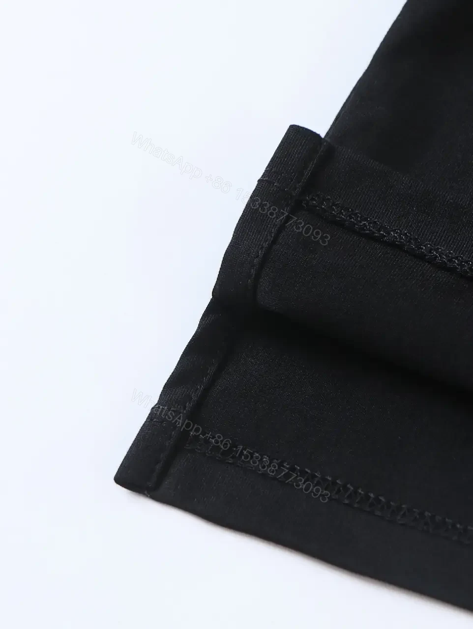 View 6 of Minimalist Black Cotton Tee: Logo-Embossed Luxury Top