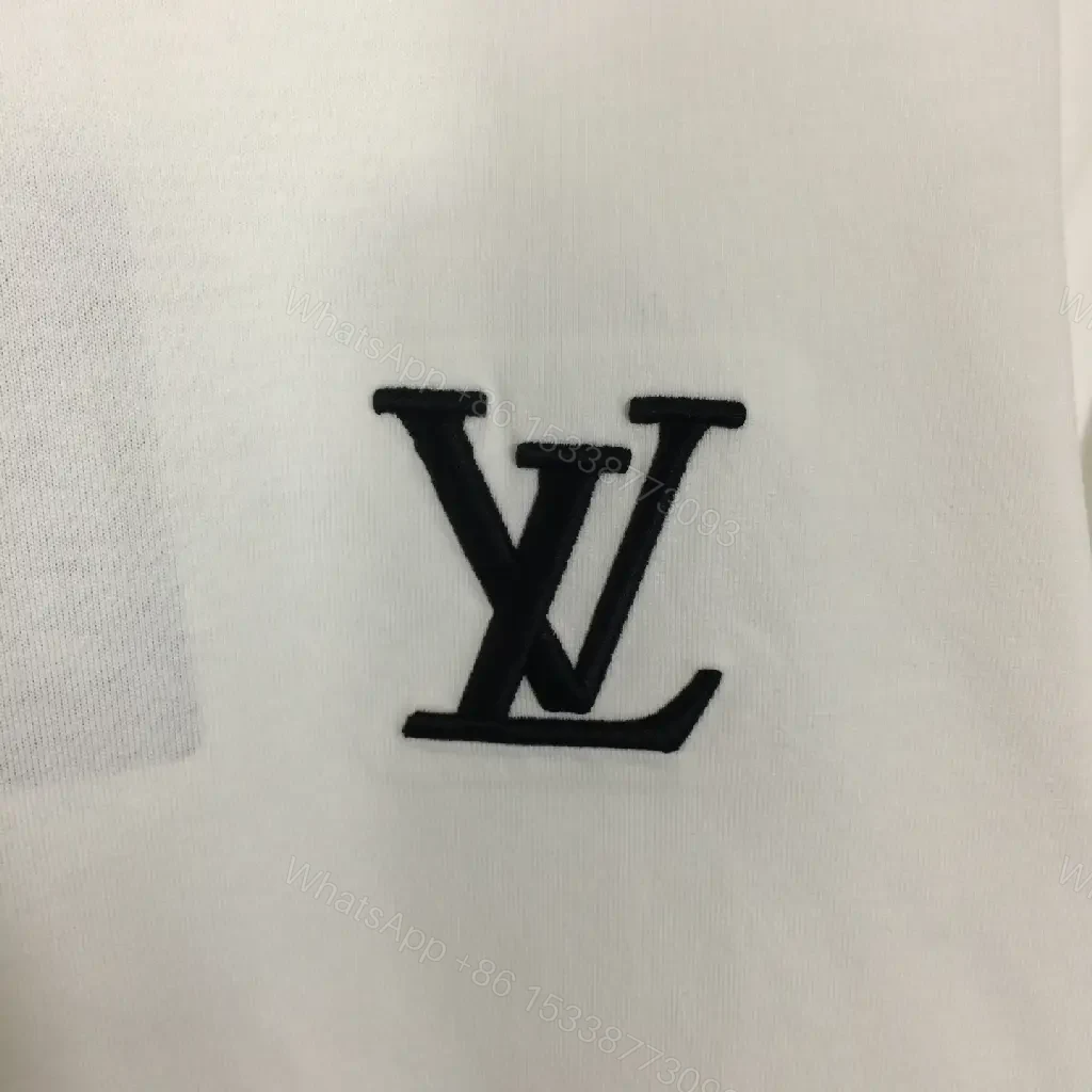 View 4 of Classic White Tee - Premium Cotton, Subtle Emblem, Everyday Luxe