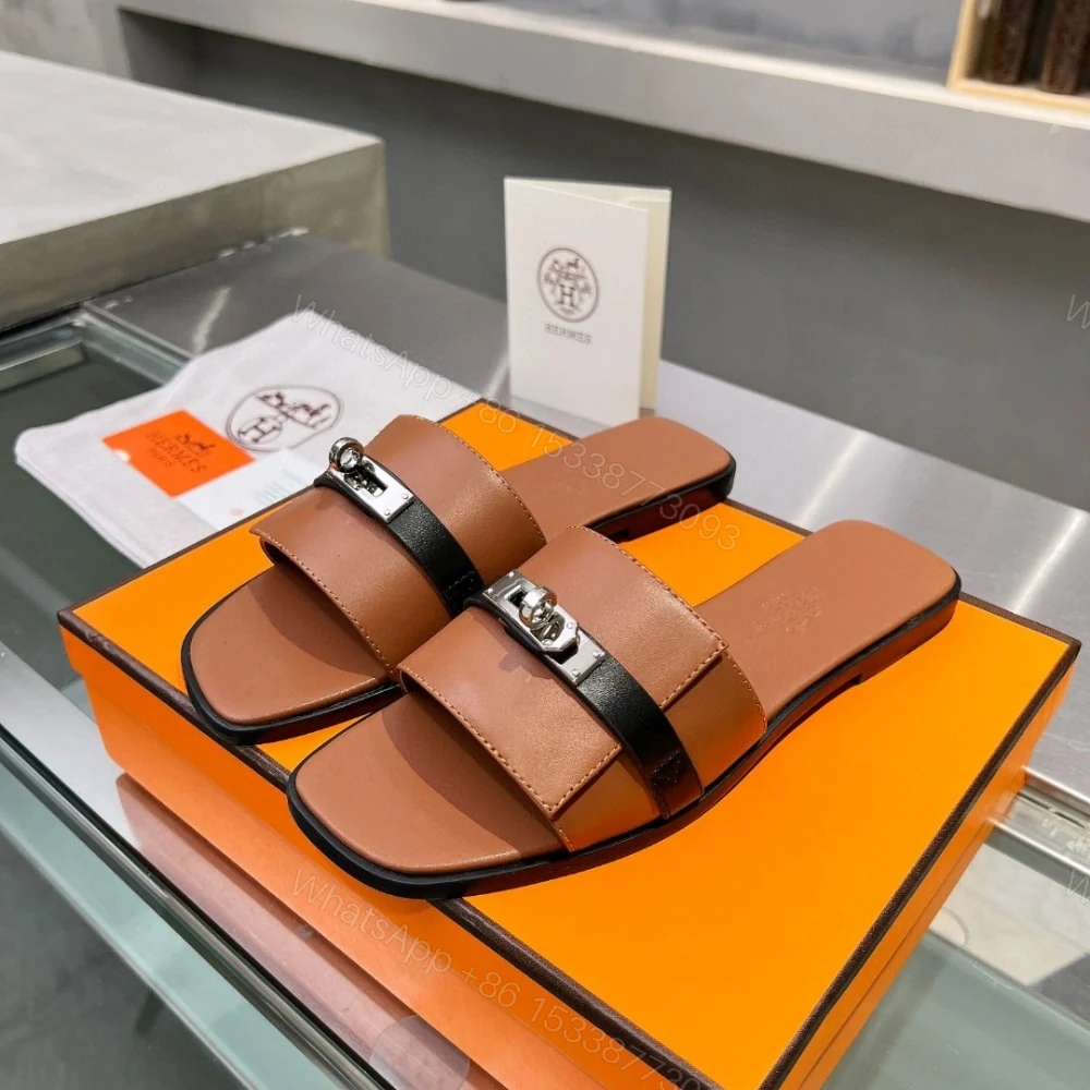 View 2 of HERMES GIULIA SANDAL GOLD AND NOIR H231056Z 20360