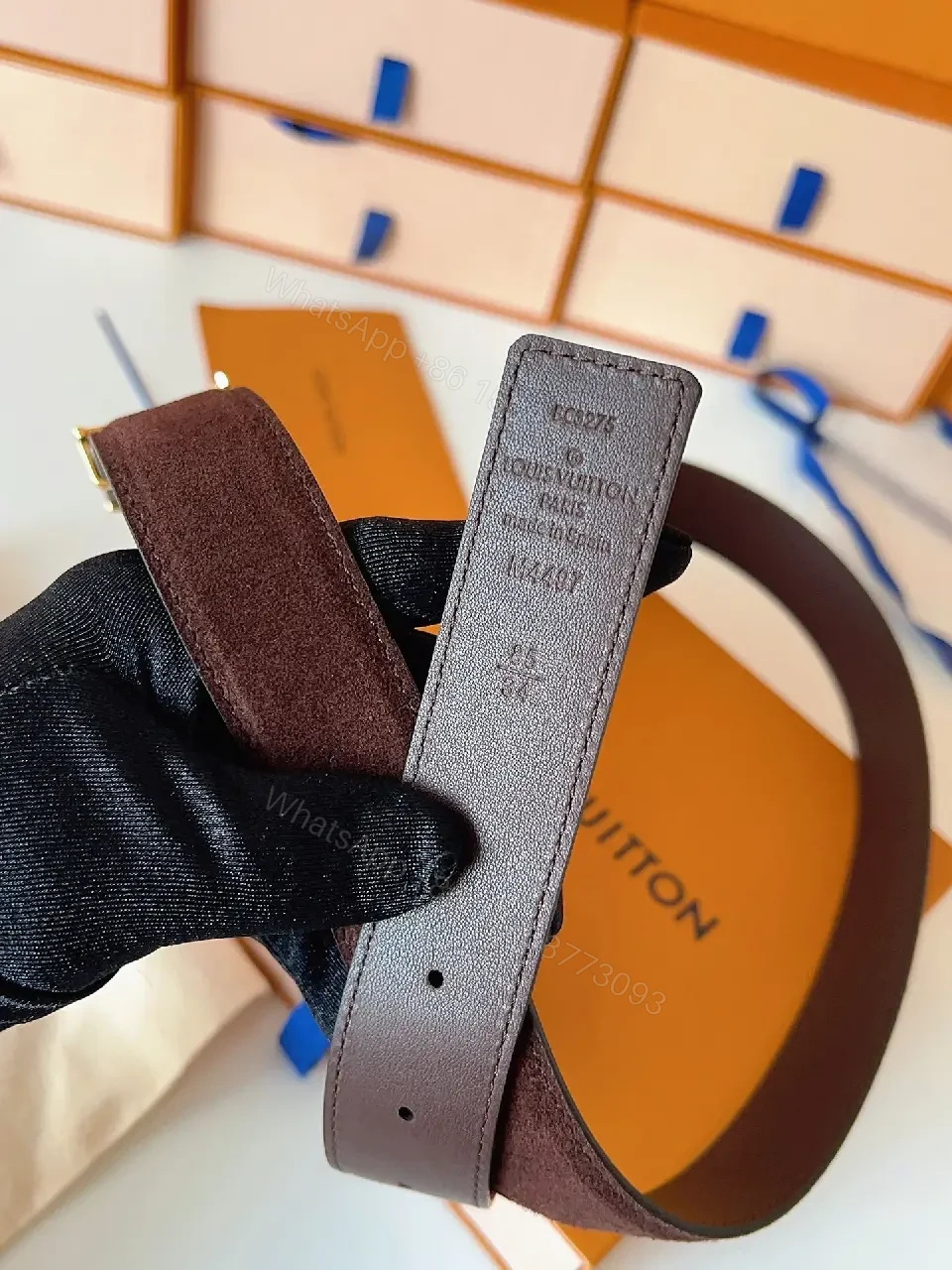 View 2 of Textured Leather Belt with Gold LV Buckle - Luxury Accessory Belt