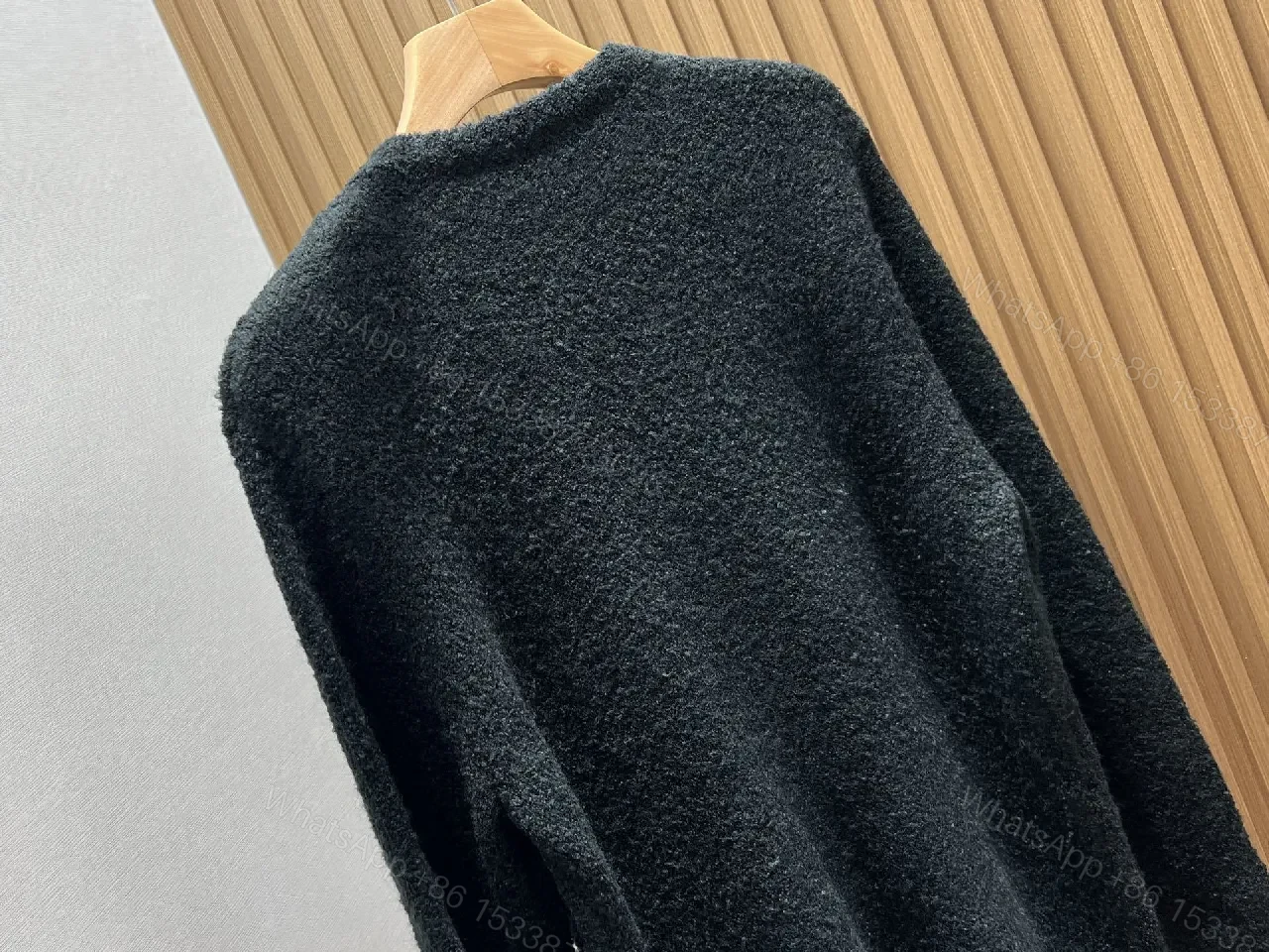 View 4 of Black Boucle Cardigan | Luxe Texture + Signature Logo + Cozy Warmth
