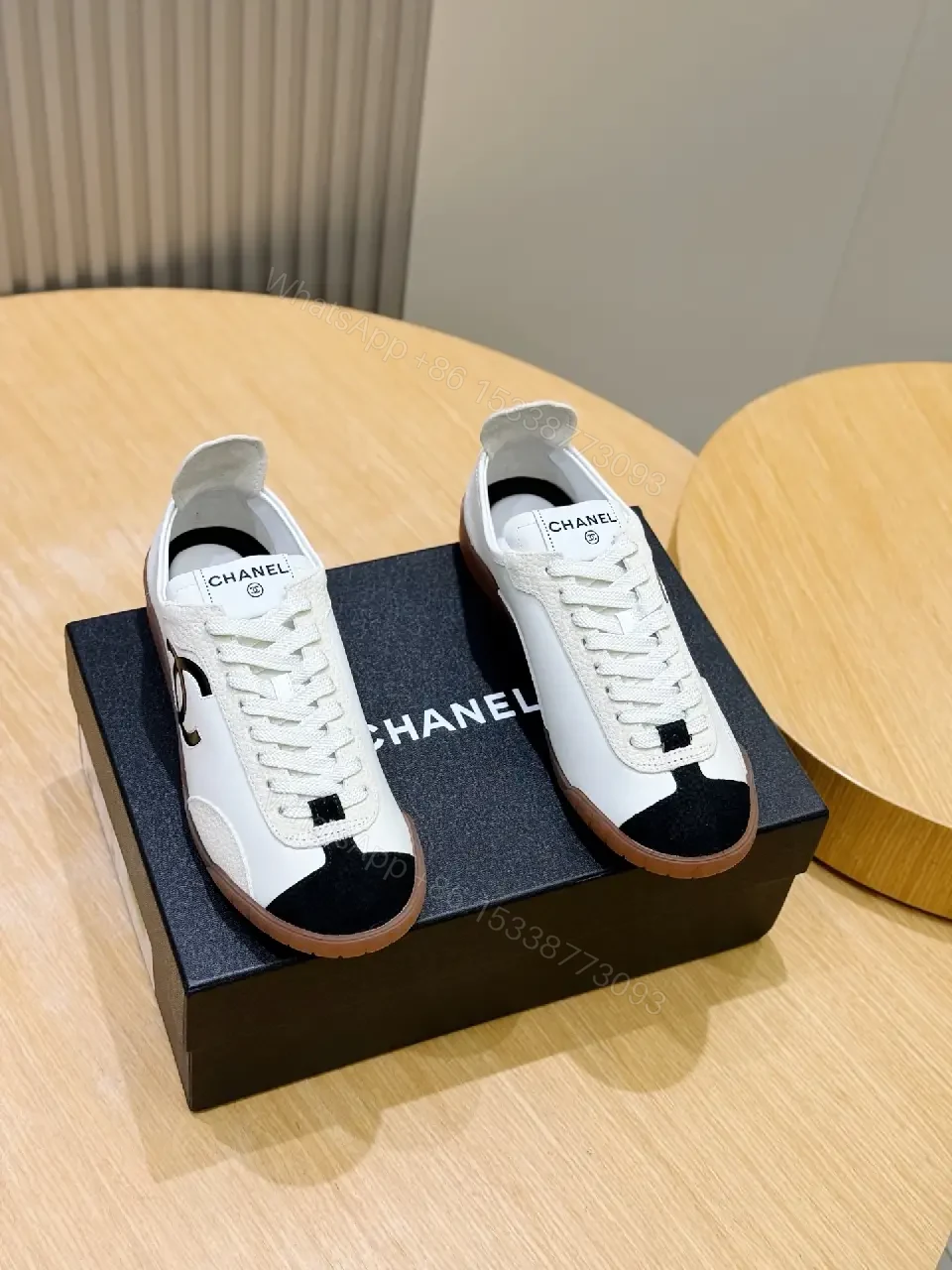 View 8 of White Leather Sneaker Black Toe Classic Chanel Logo Shoes