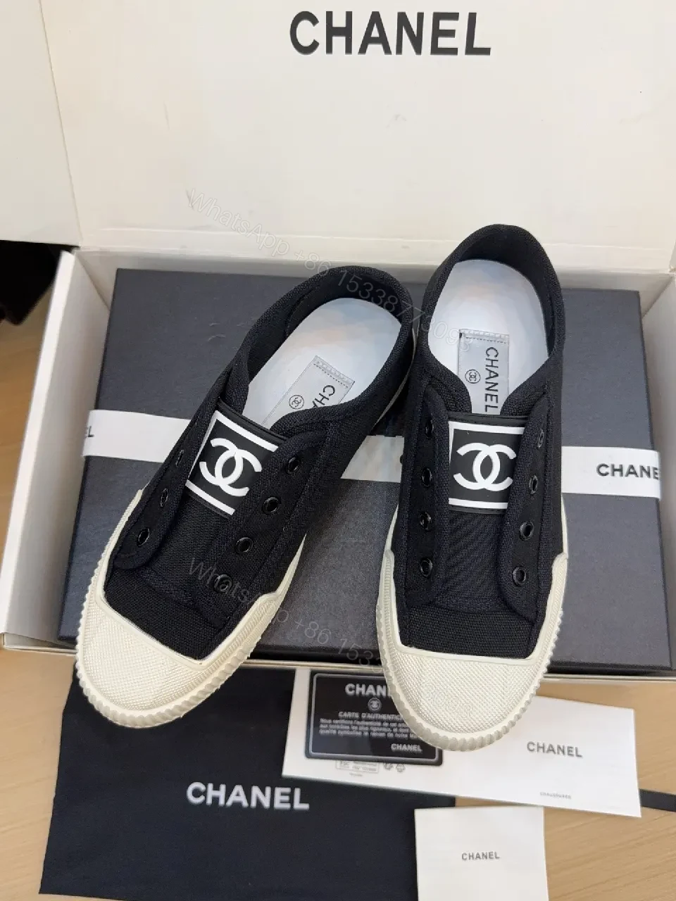 Minimalist Black Canvas Sneakers with Logo Strap — view 1