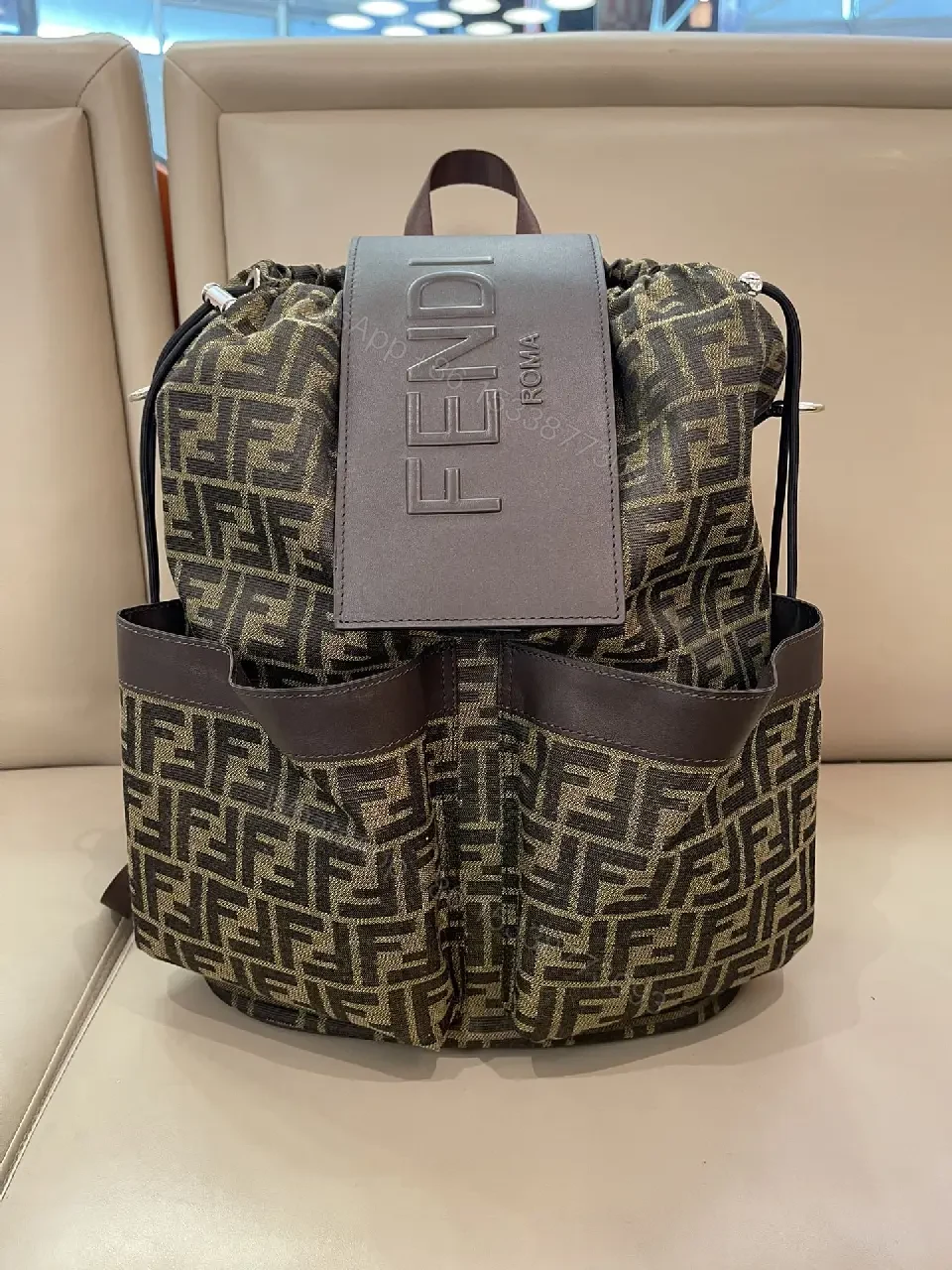 View 3 of Brown/Olive Modern Backpack with Fendi Monogram, Leather Accents, Gray Flap