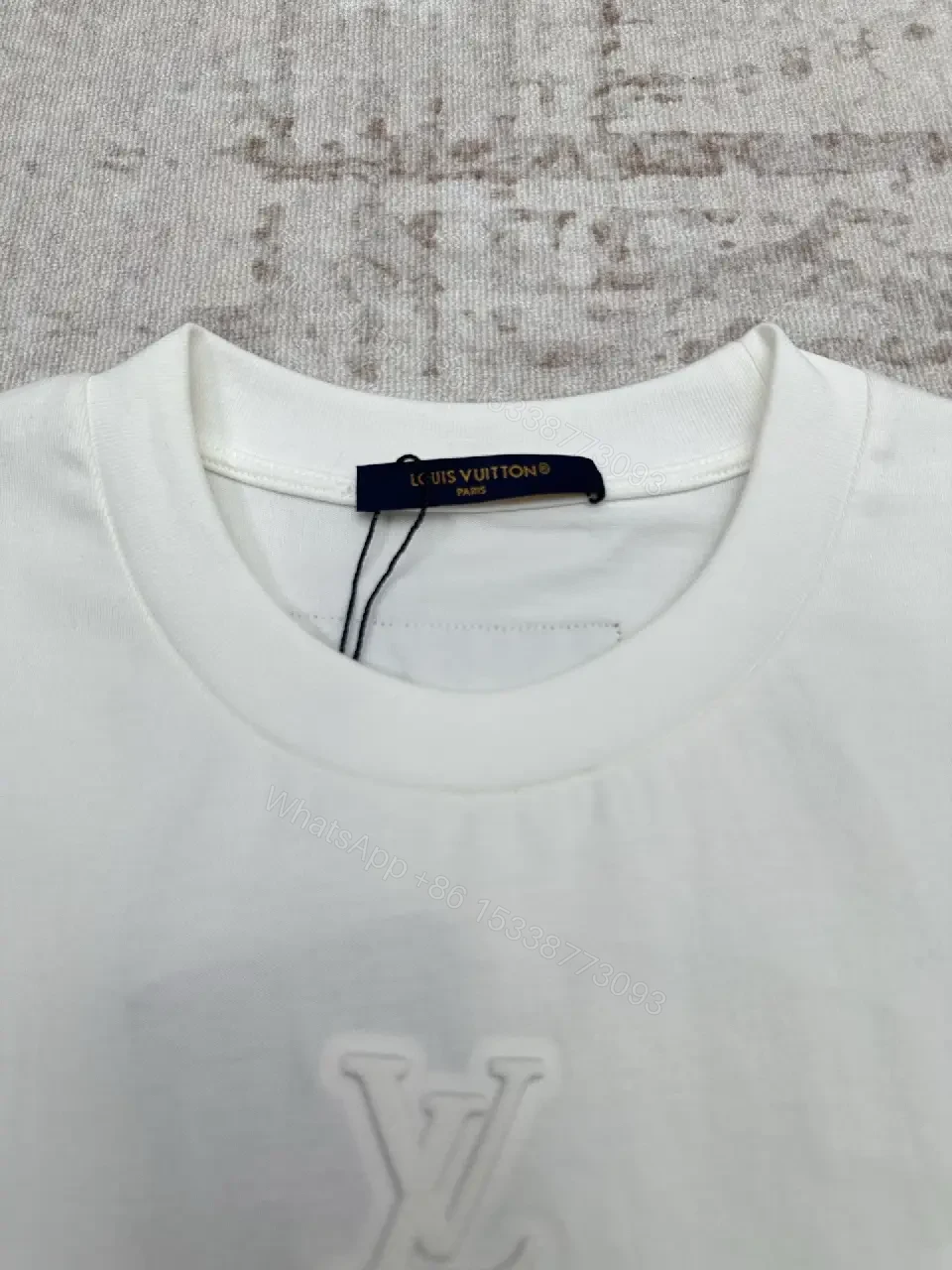 View 9 of Minimalist White Cotton Tee with Embossed Accent, Everyday Luxury