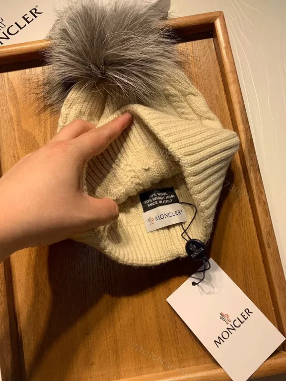 View 4 of Cream Cable-Knit Beanie with Faux-Fur Pom-Pom: Moncler Warmth