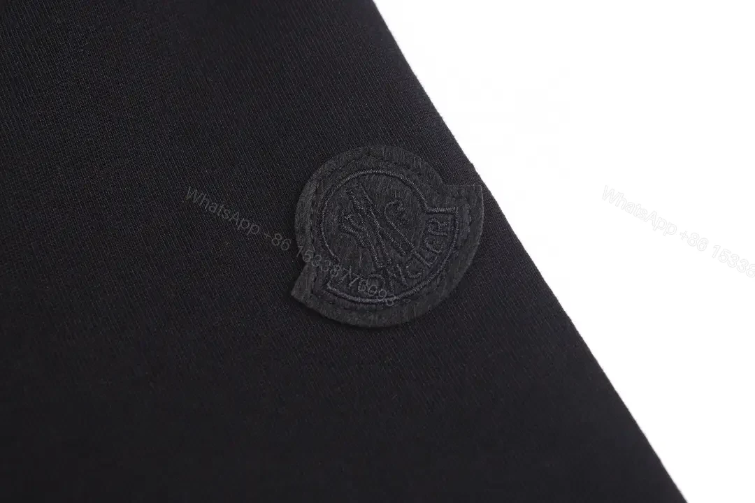 View 10 of Minimalist Black Tee, Premium Cotton, Modern Fit, Logo Detail, T-Shirt