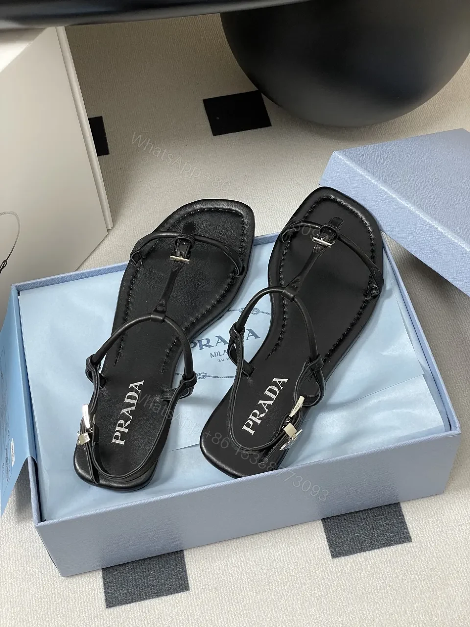 Minimal Black Leather T-Strap Sandals with Padded Comfort — view 1