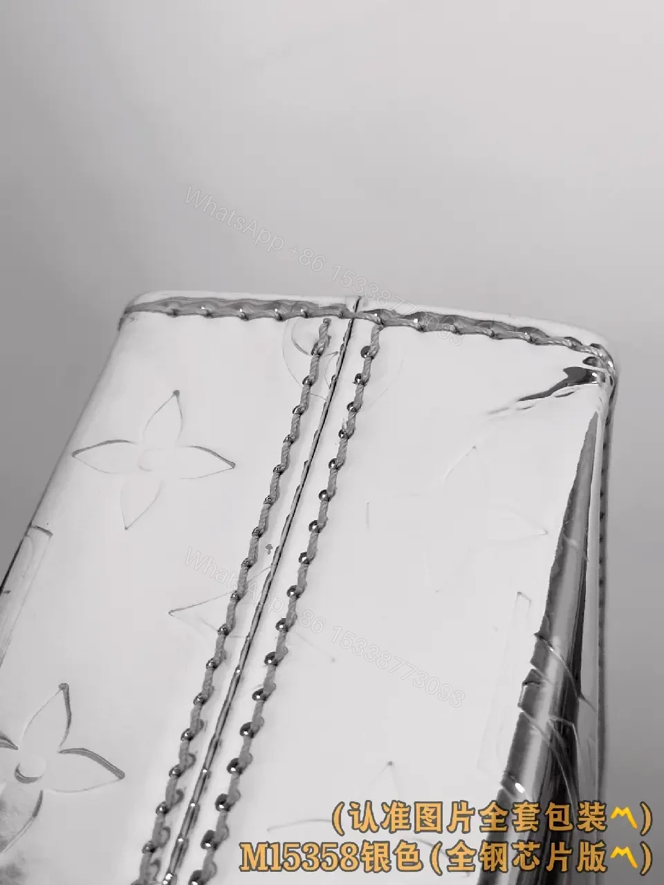 View 5 of Metallic Silver Pouch with Signature Motifs—Chic All-Day Gleam
