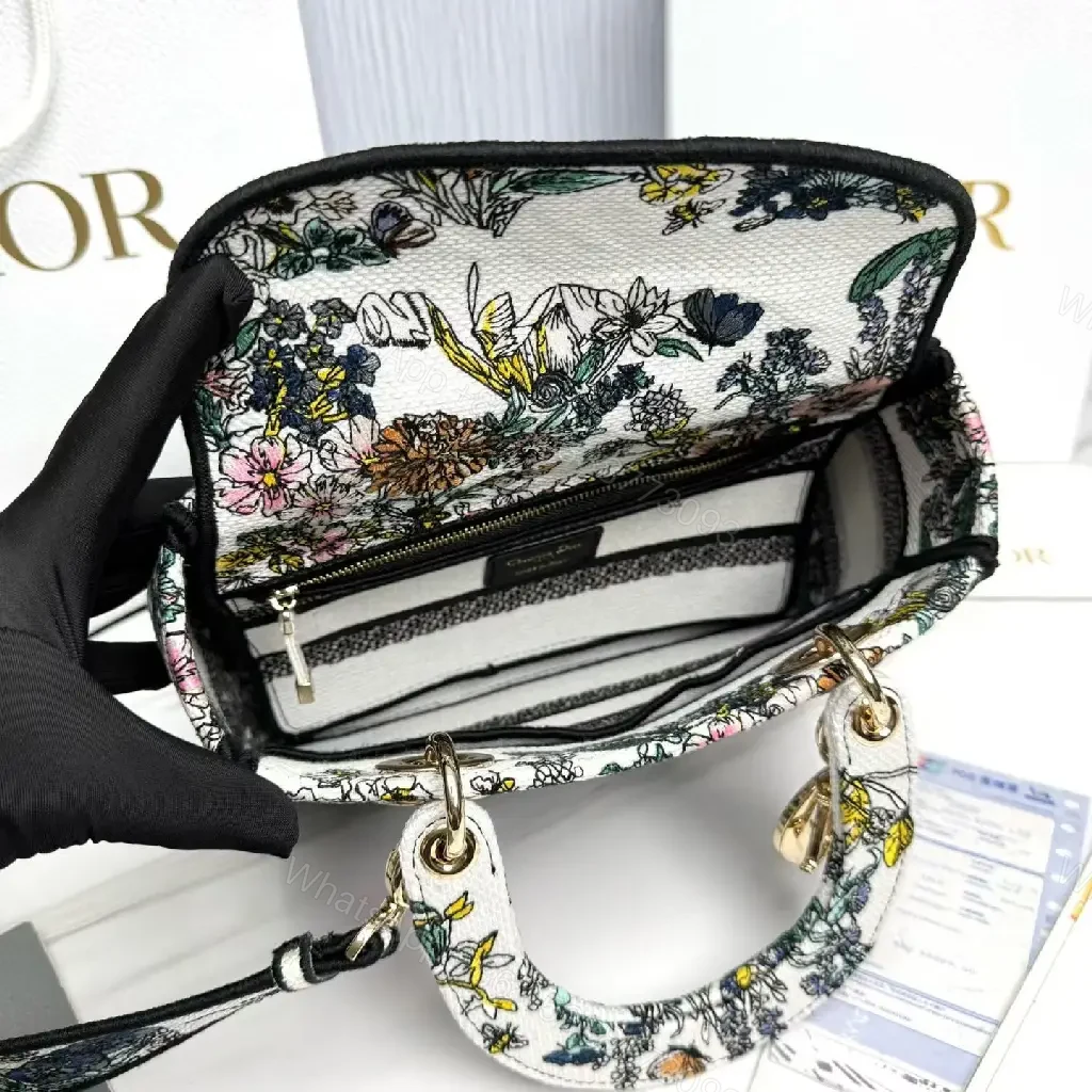 View 2 of Floral Canvas Luxe Bag with Logo Detailing Handbag