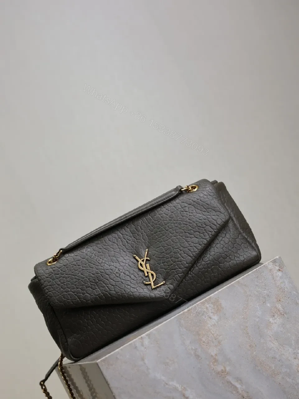 View 9 of Textured Leather Envelope Bag: Black + Gold Accent, Compact Luxury Shoulder Bag