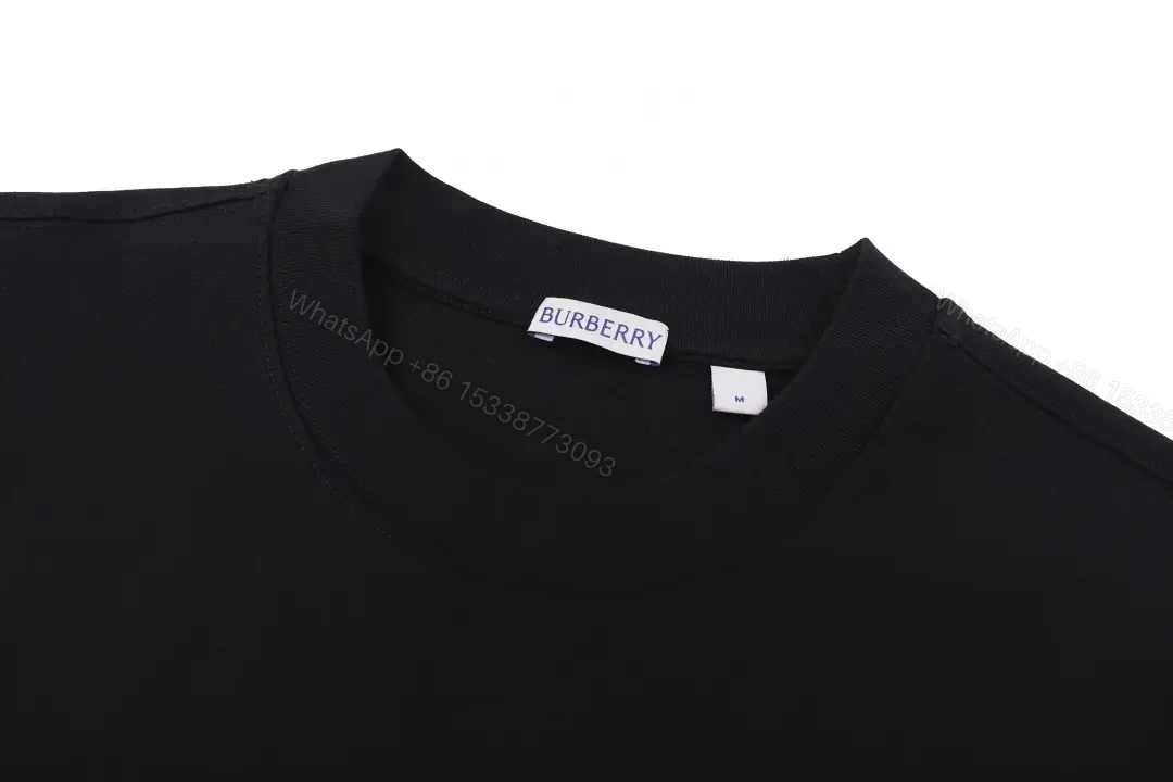 View 9 of Black Cotton Logo Tee: Subtle Crest, Everyday Luxe Top